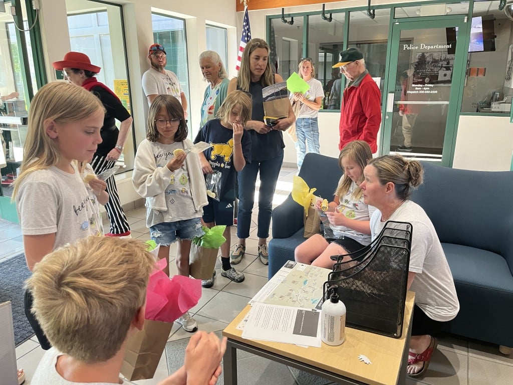 Ms. Colleen talks to her students following their presentation.